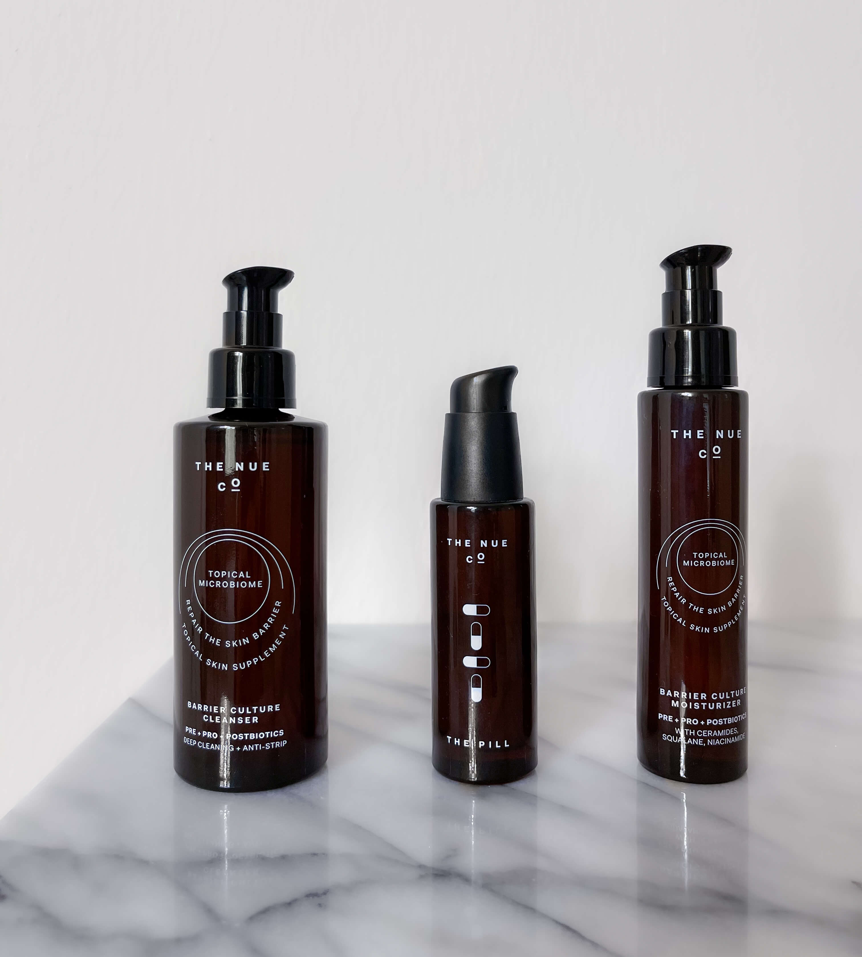 The Nue Co Topical Skin Supplement System (L-R): Barrier Culture Cleanser; The Pill; Barrier Culture Moisturizer
